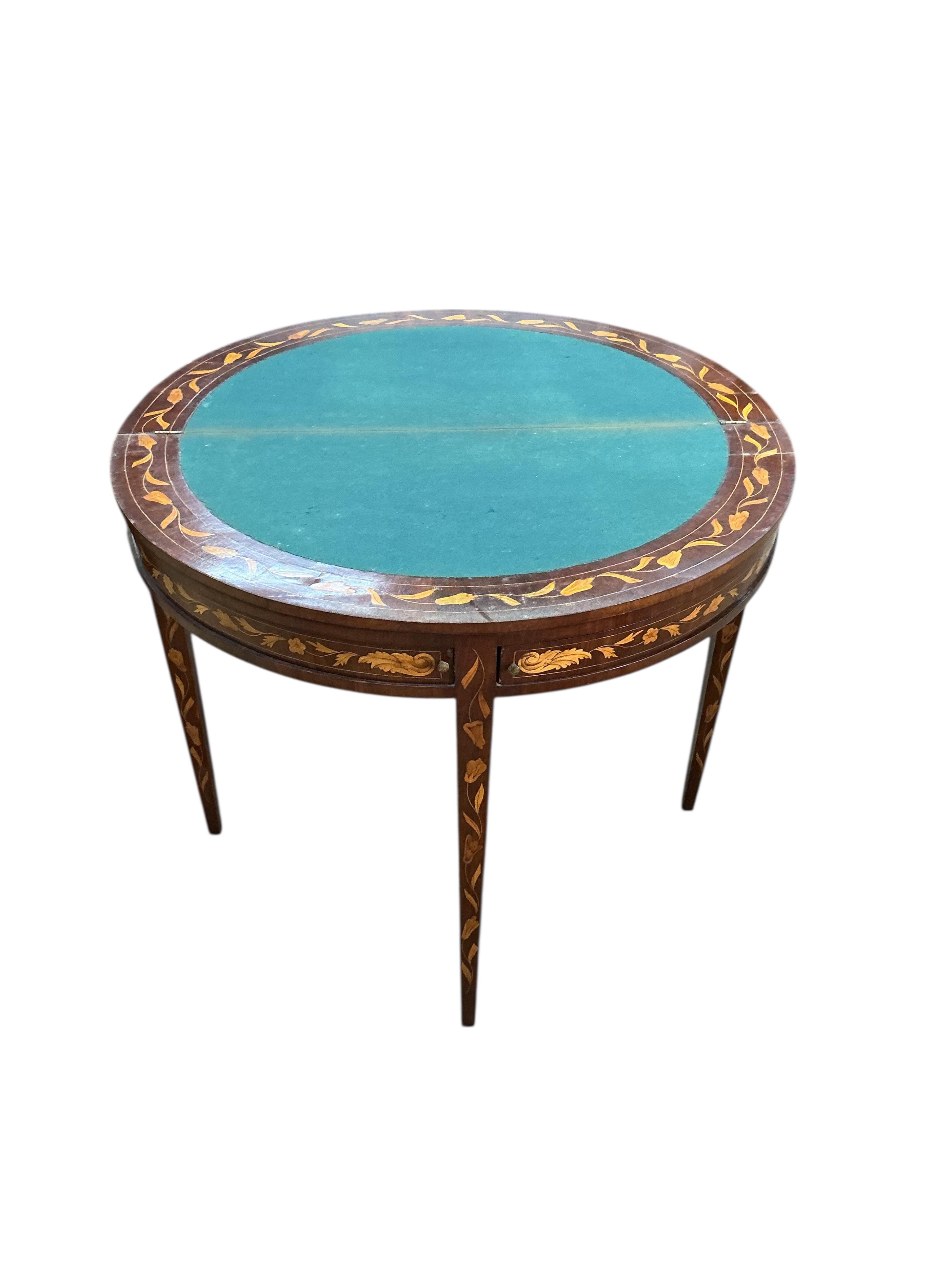 An early 19th century Dutch walnut floral marquetry folding card table, width 88cm, depth 44cm, height 76cm